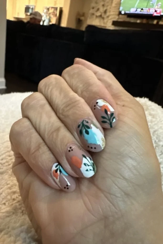 Abstract botanical nail art with leaf accents and warm tones for fall transition nails ideas