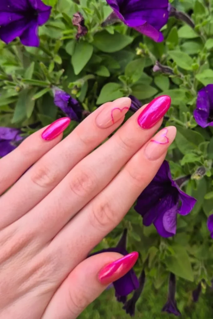 August Nails Ideas featuring vibrant hot pink chrome nails paired with nude accent nails outlined in pink heart nail art