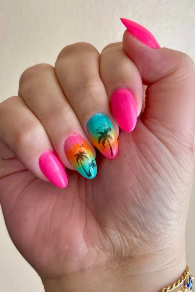 Bright pink nails featuring a sunset gradient accent nail with black palm tree silhouettes for vacation nails ideas