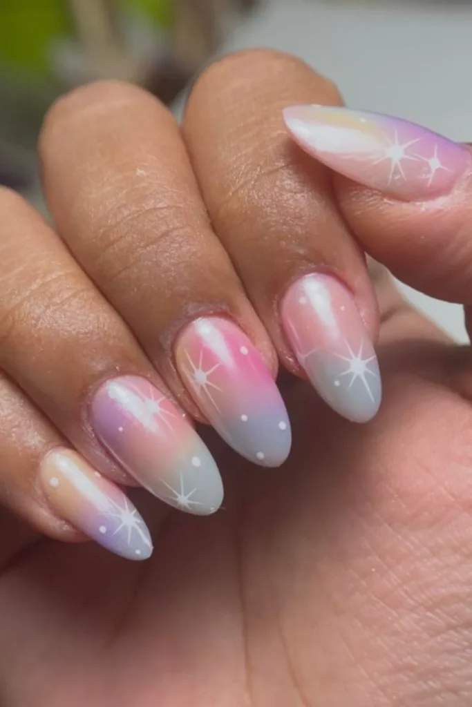 Sunset pastel aura ombre nails with starburst nail art for end of summer nails